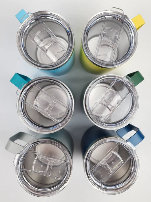 Set of six colorful insulated travel mugs with clear lids on a light gray background