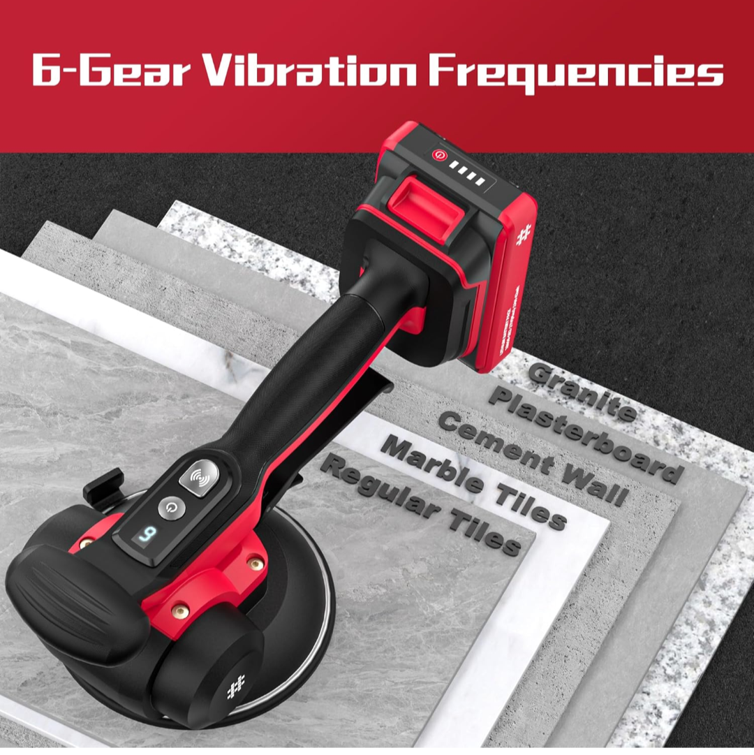 Red and black tool with vibration frequencies text on a gray surface